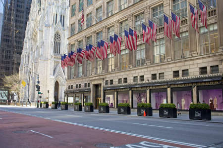New York, NY, USA - July 5, 2021: Sachs Fifth Avenue and St Patrick's Cathedral on a spring morning...