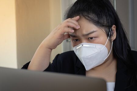 Young business woman working from home wearing protective mask.Working from home.quarantine for...