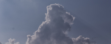 Black and white cloud in blue sky
