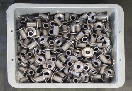 Stack of automotive machined steel parts keeping in stock