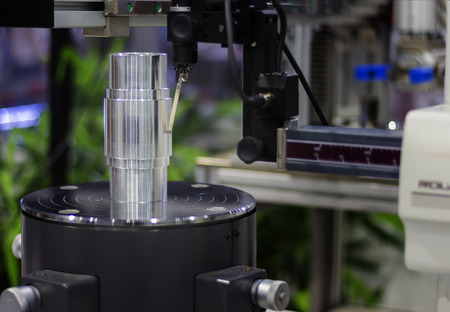 Roundness tester measuring workpiece on turntable ;focus in stylusの写真素材