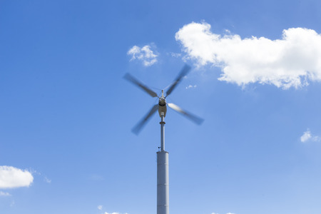 the wind turbines againt blue sky ; selective focus