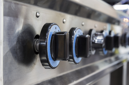 Close up switch of Kitchen burning gas cooker ; knob
