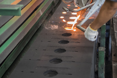molten metal pouring in green sand mold