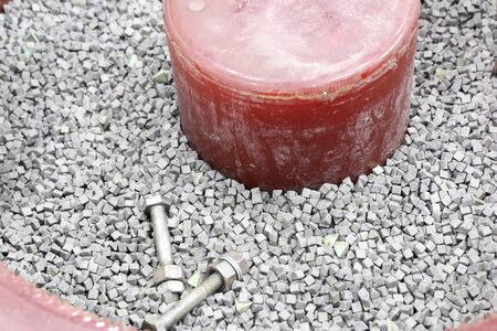 The barrel finishing  machine :Abrasive media, work pieces, compound and water are loaded into...
