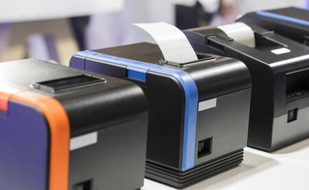paper slip exit from thermal printer ; business background 
