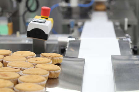 cupcake packing machine ; food industrial business backgound ; selective focusの写真素材