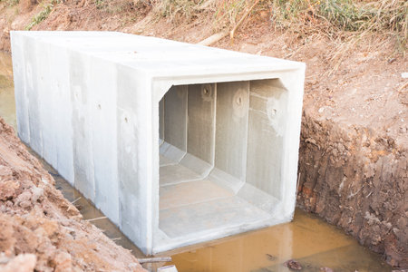 Large size square concrete manholes are  installed at construction site ; for draining storm water of main road ; civil constrution backgroundの写真素材