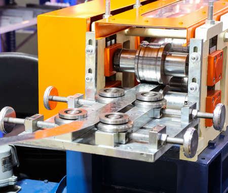 stainless sheet exit from die in cold roll process ;  engineering  equipment industrial background