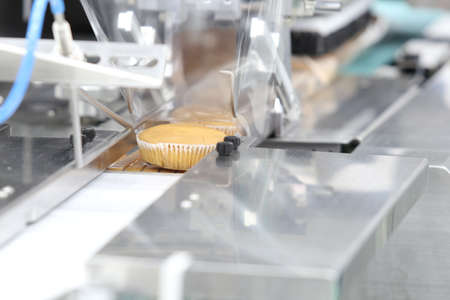 cupcake packing machine ; food industrial business backgound ; selective focusの写真素材