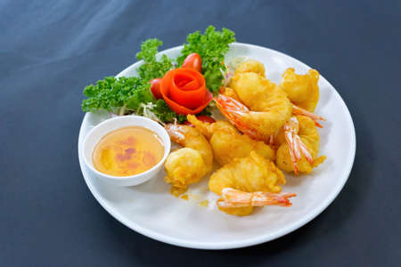 fried shrimps or prawns with sauce on a white plate with sauce It's the best foodの写真素材
