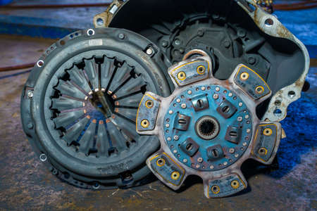 clutch plate and Clutch Cover expire on background gear transmission.Old Metallic clutch on Truck clutch systemの写真素材