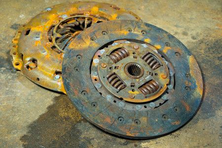 clutch plate and Clutch Cover expire on dirty background.There are rust stains.maintenance services clutch.の写真素材