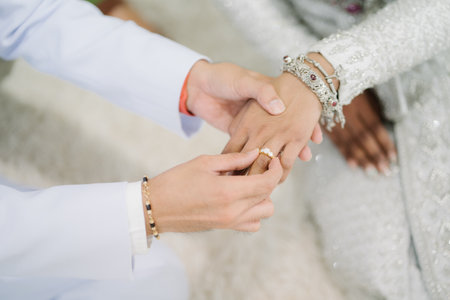 Bride and groom holding hands on wedding day. Wedding day concept.Thailand wedding.の写真素材