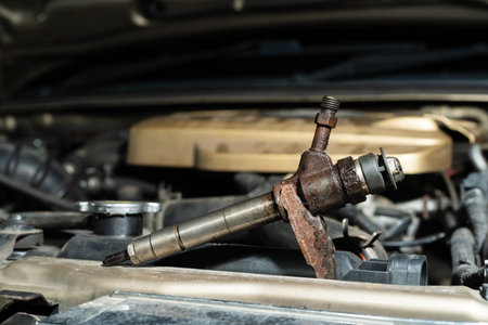 Repair fuel injection.Common rail diesel injection system on track..Under the hood of an old car is an old rusty engine.の写真素材