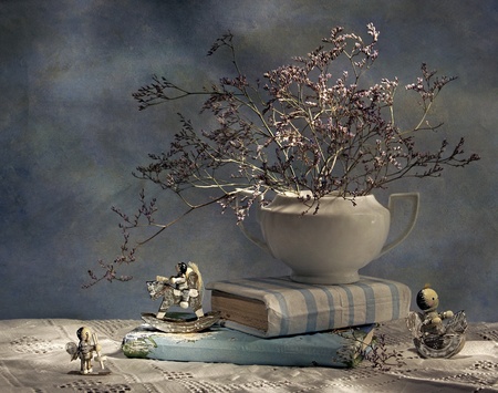 still life with books and wooden figurinesの写真素材
