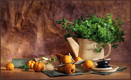 still life with quince and greensの写真素材