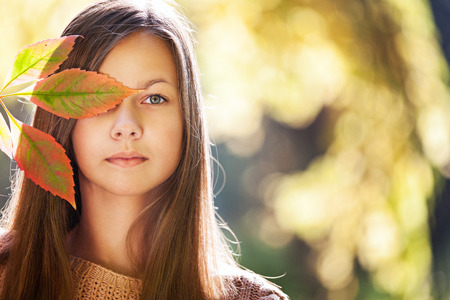 girl in autumn parkの写真素材