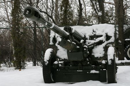 Gun under a snow on eternal parking in winter parkの写真素材