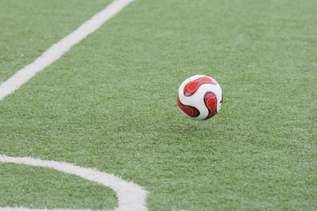 Football in stadium with an artificial covering before the beginning of game.の写真素材