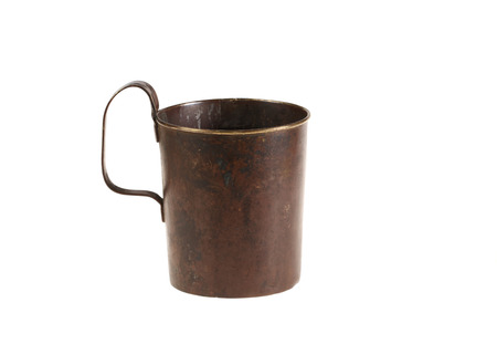 Ancient old bronze mug with the handle  Isolatedの写真素材