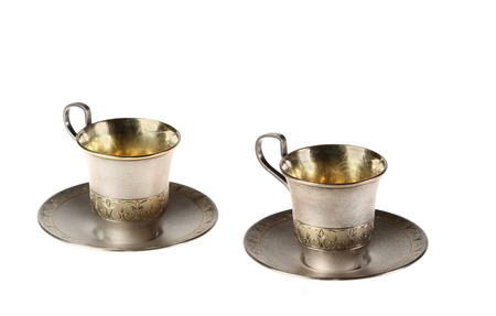 Two small cups coffee with saucers  Gold covering  Isolatedの写真素材