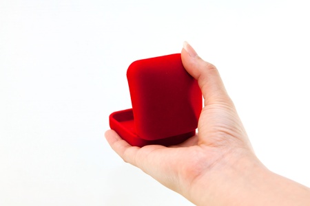 woman hand and ring box on white backgroundの写真素材