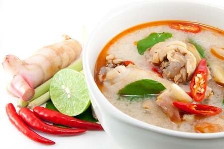 chicken wing tom yum in bowl (Thai food) and herb ingredient on white backgroundの写真素材