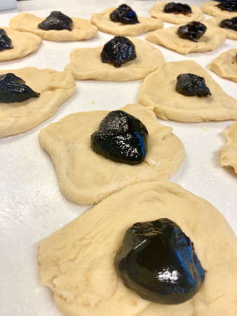 The process of homemade production of Czech buns stuffed with plum jamの写真素材
