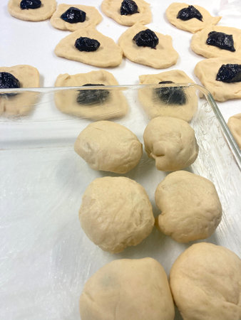 The process of homemade production of Czech buns stuffed with plum jamの写真素材
