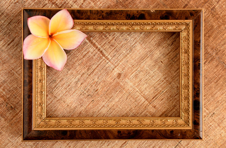 Wooden old photo frame on old wooden background.の写真素材