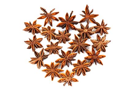 Chinese star anise, Star anise, fruits paste on a white background.à¹à¸à¹à¸¢à¸à¸±à¹à¸ Chinese star anise, Star anise, fruits have medicinal properties and on a white background. (Arranged in a heart shape)の写真素材