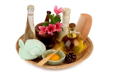 Soak hair with hibiscus flowers, egg yolks and oil for healthy hair. It has medicinal properties and on a white background.の写真素材