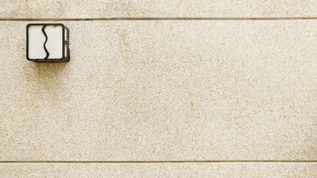 brown wash gravel on the wall with Lampの写真素材