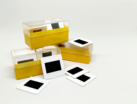 old 35mm slide film with box isolated on white background.の写真素材