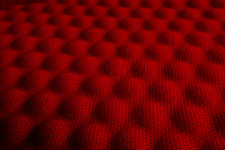 Red convex nylon fabric pattern texture background.の写真素材