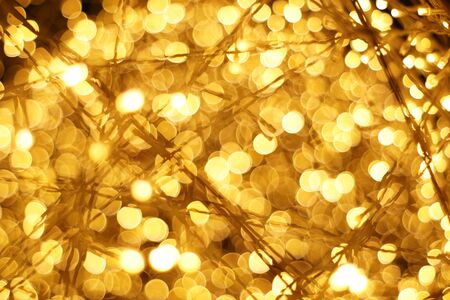 The golden bokeh blurred abstract pattern background.の写真素材