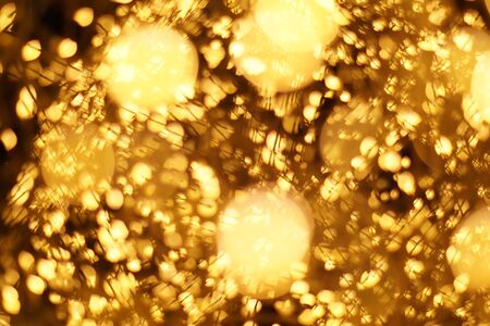 The golden bokeh blurred abstract pattern background.