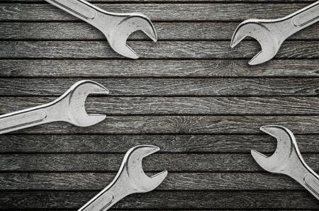 Wrenches on natural wooden background.の写真素材