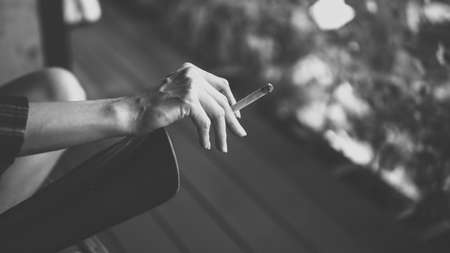 The cigarette in woman hand.の写真素材