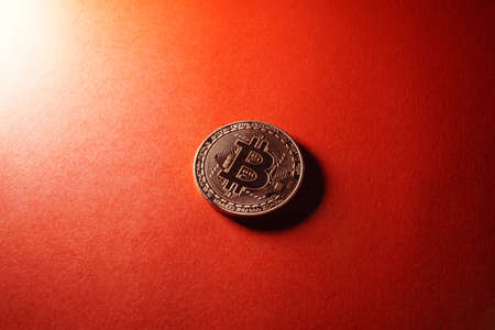 Bitcoin crypto currency isolated on red background.の写真素材