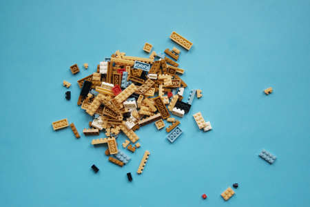Group of plastic toys on blue background.