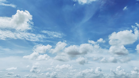 The Bright blue sky and beautiful clouds.