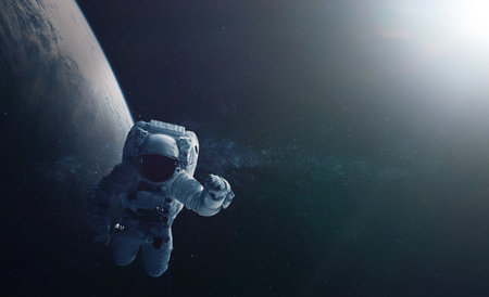 Astronaut and space background. Elements of this image furnished by .