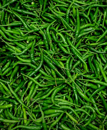 Fresh Green chili pile background. Top view.の写真素材