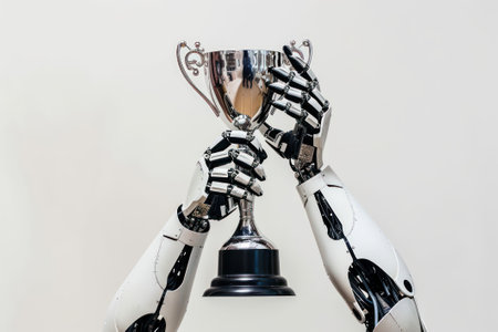 A robot holds a trophy in its hands.の素材