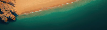 Aerial view of a serene beach with golden sand and tranquil blue waters.の素材