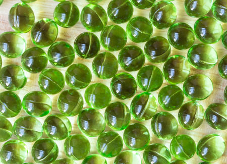 Supplement food,Vitamin E capsule on wooden table.の写真素材
