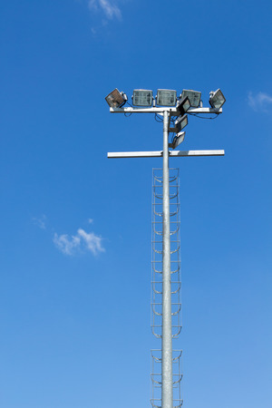 Spot light pole with blue sky in the stadiumの写真素材