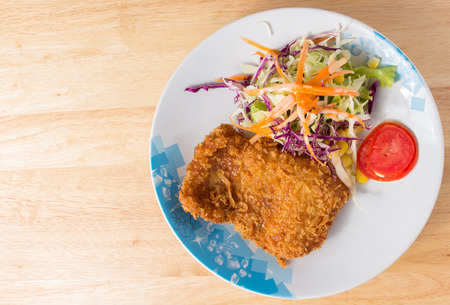 fish steak on wood tableの写真素材